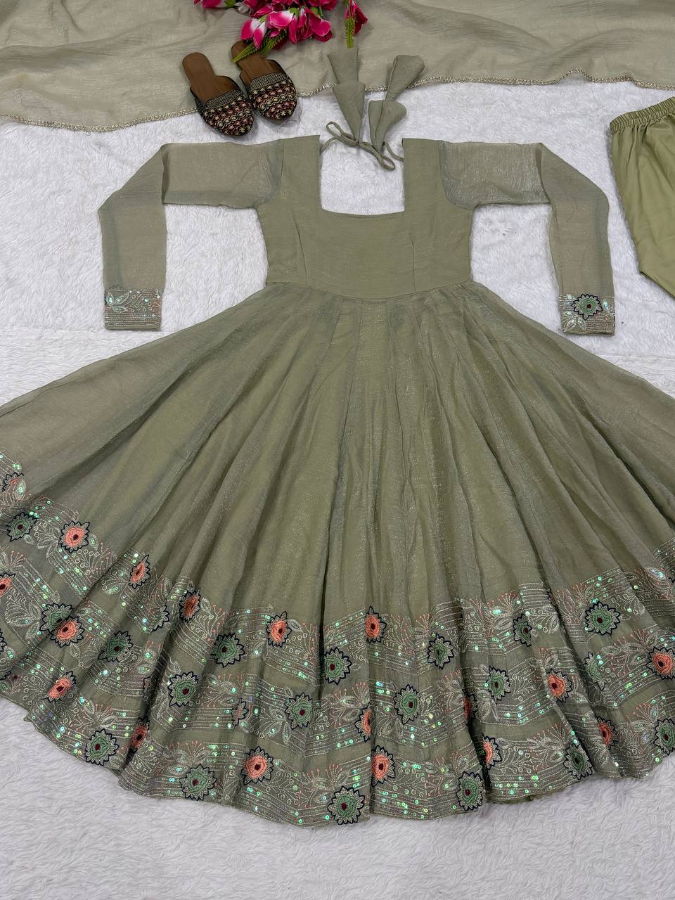 Ethereal Mehendi Green Flared Anarkali Suit Set Adorned with Luminous Sequined Floral Motifs, Embroidered Cuffs, and an Ornate Heritage Hem